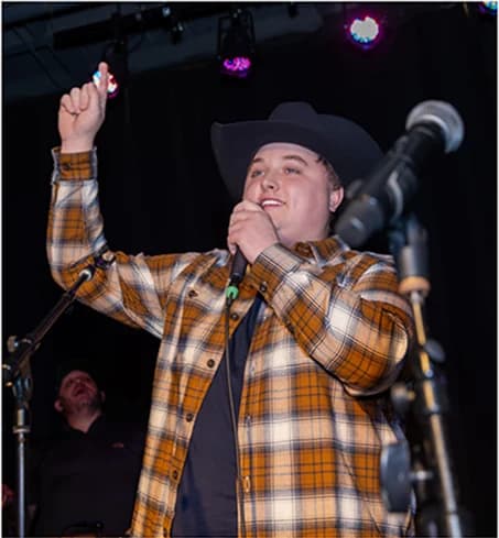 Jackson Edwards performing at Rock the Cause